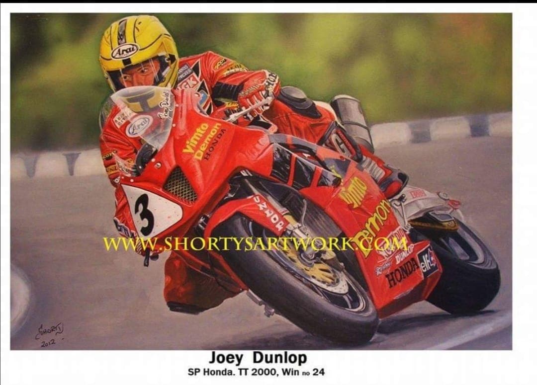 Joey Dunlop on the red Vimto Honda SP-1 at the 2000 TT