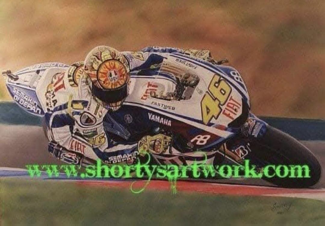 Valentino Rossi, number 46, at full lean on the Fiat Yamaha M1
