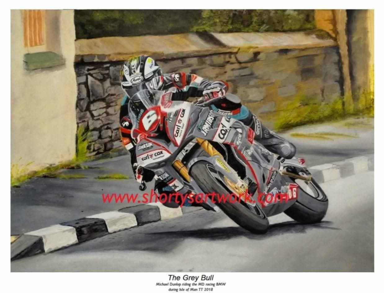 Michael Dunlop on his superbike, aggressive lean through a corner